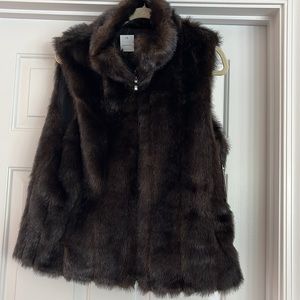 Reversible fake fur, zipper vest. New w/tags. Size L. $35.Color mink/ or black